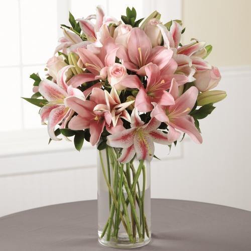 Always and Forever Sympathy Bouquet with pink roses and pink Asiatic lilies in clear glass vase.