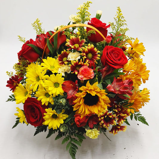 Autumn Celebration Bouquet in rustic orange basket with warm fall flowers.
