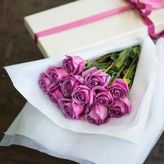 Dozen Boxed Premium Roses – 12 purple long-stemmed roses in elegant rose box.
